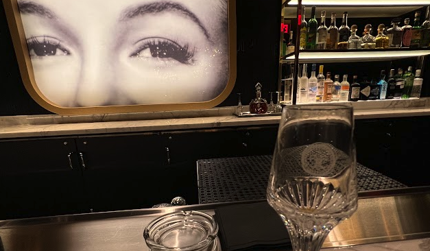 A screenshot of Marilyn Monroe's eyes behind the secret bar at Circa Resort.